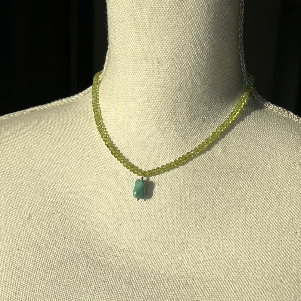 Green beaded shirt necklace with turquoise drop